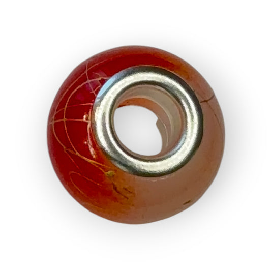 Charm esfera bicolor naranja motivos dorados